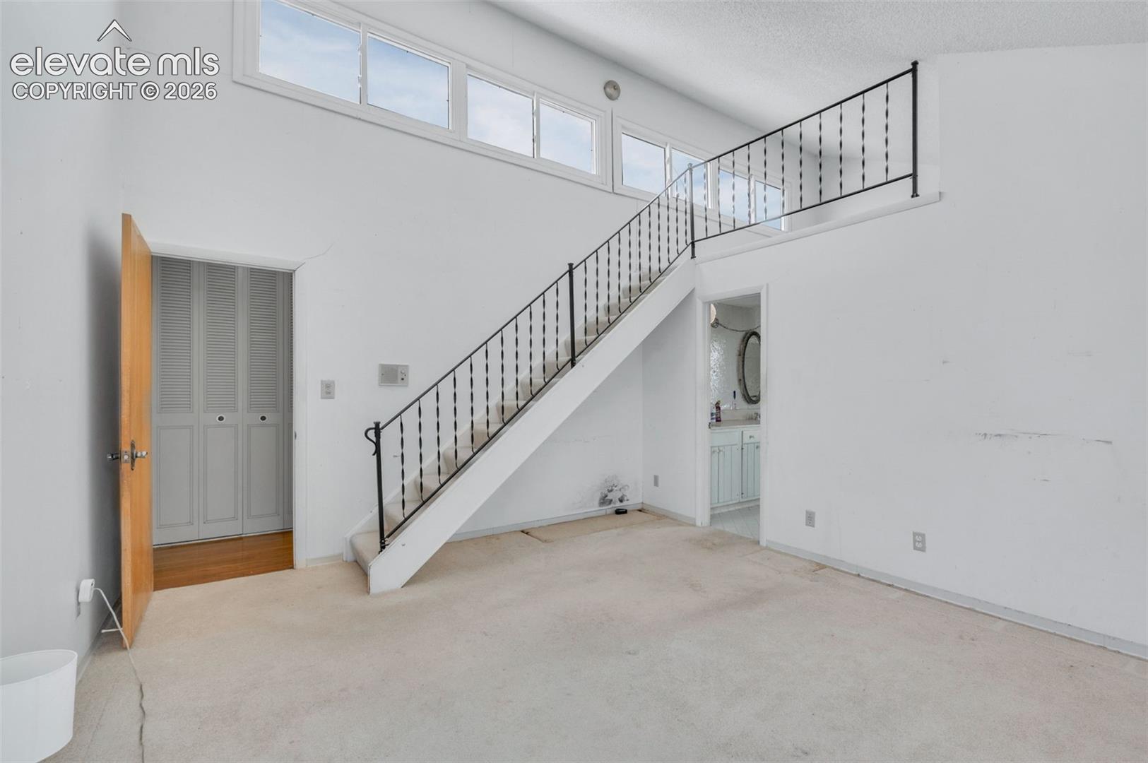 24975 Sanborn Road Calhan, CO 80808 - Photo 20 of 50 Stairs lead to the loft study