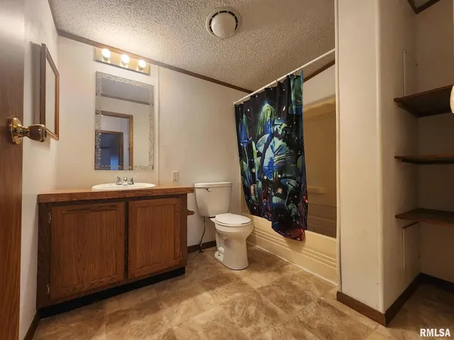 an empty room with wooden floor and closet