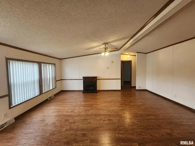 a view of a livingroom with wooden floor
