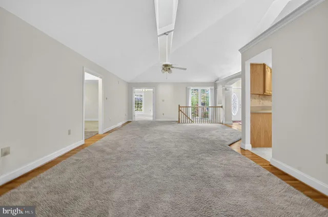 a bathroom with a granite countertop sink and a bathtub