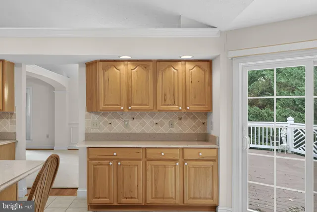 a bathroom with a granite countertop sink a toilet a mirror and shower