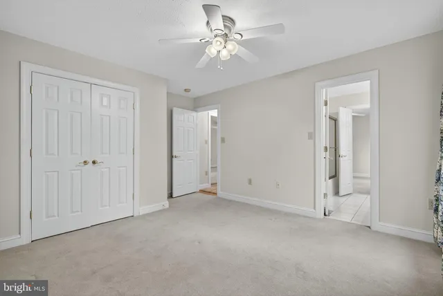 a room with pool table and windows