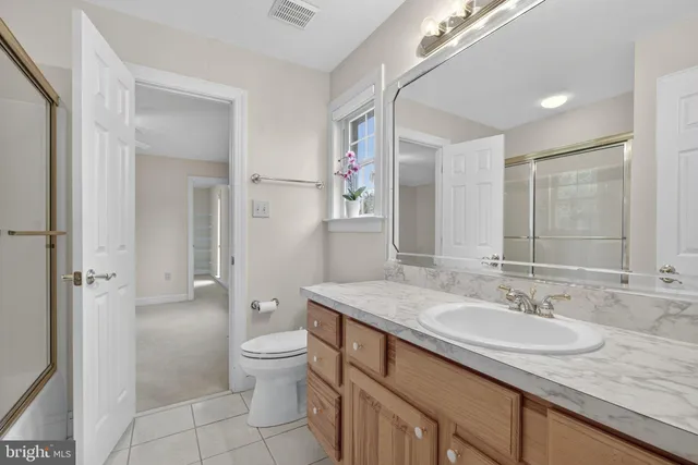 a room with furniture and a pool table