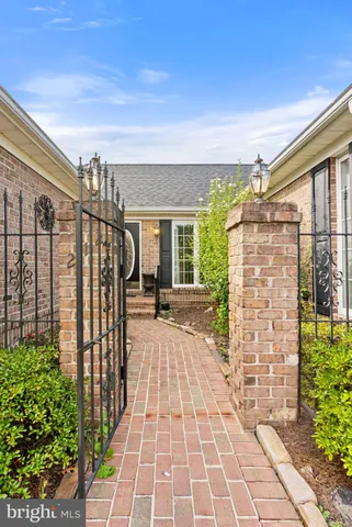 a view of empty room with fireplace and window