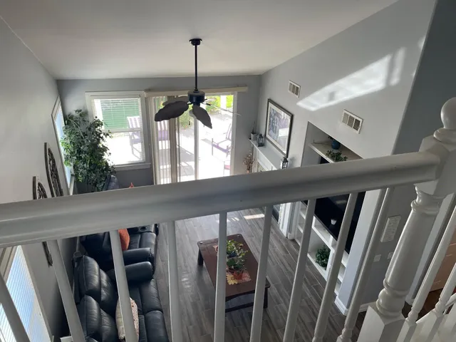 a front view of a house with garden and sitting area