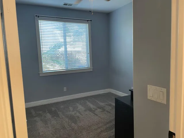 an aerial view of a house with swimming pool and mountain view