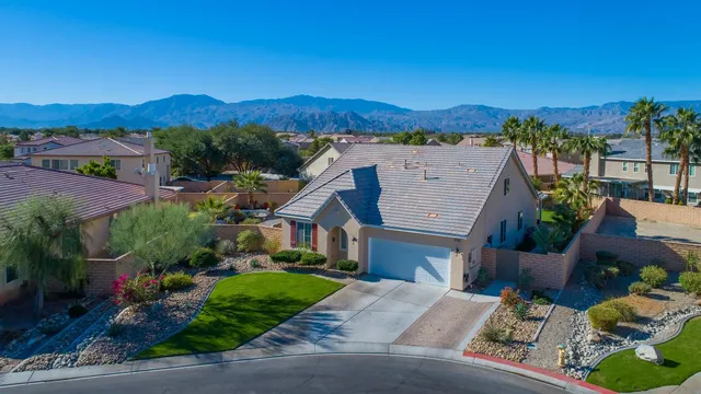 an aerial view of a house with a garden