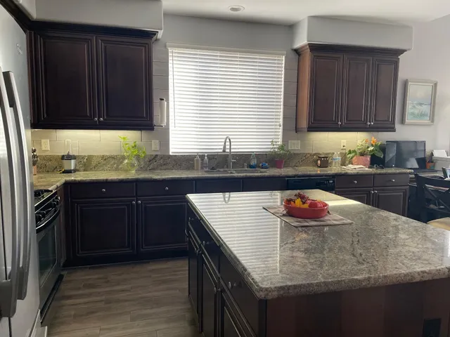 a view of a livingroom with furniture window and wooden floor