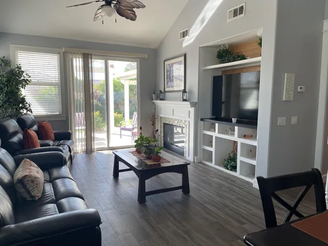 a large bed sitting in a bedroom next to a window