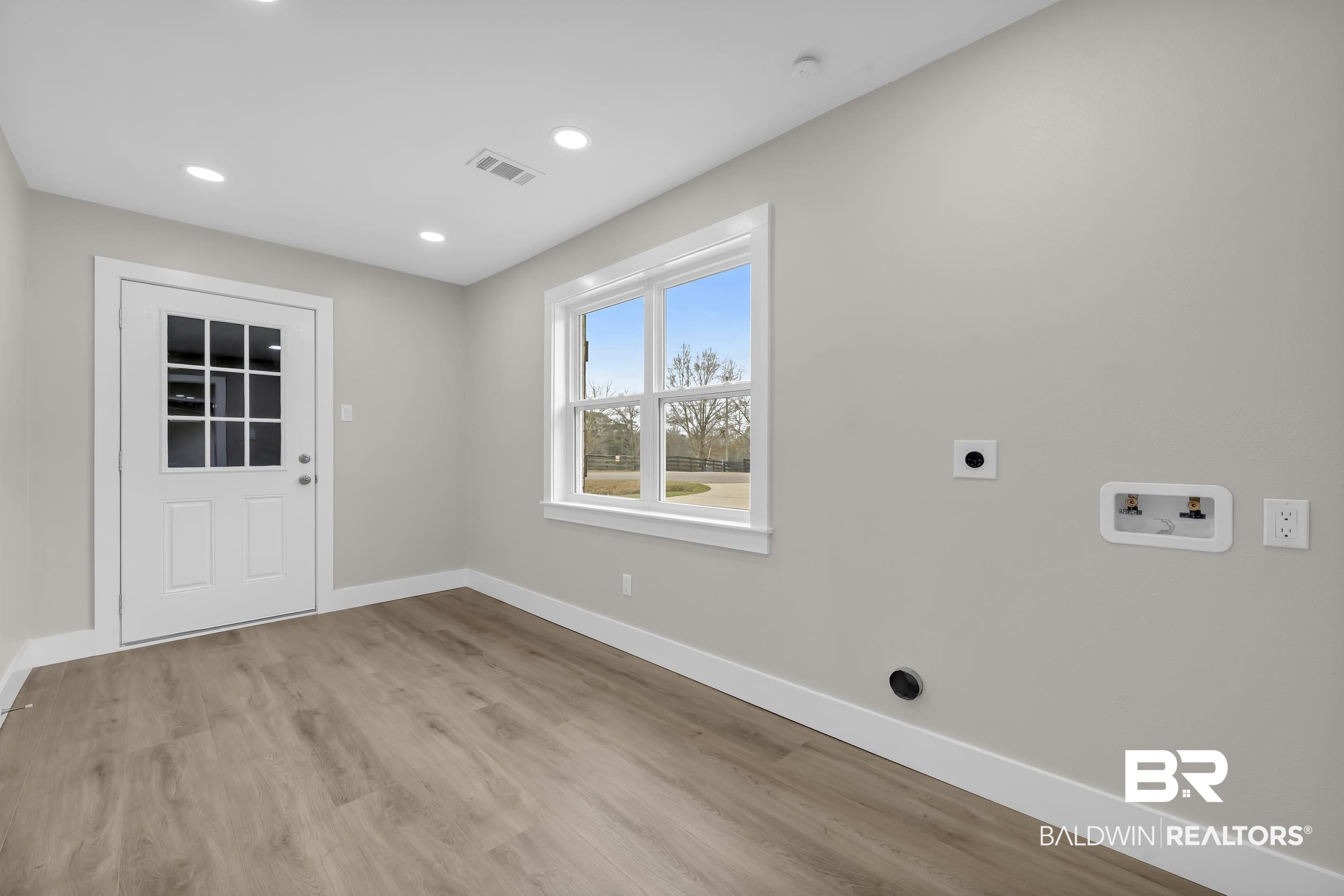 11381 Normandy Drive East Semmes, AL 36575 - Photo 19 of 23 Laundry room featuring light wood-style floors, washer hookup, hookup for an electric dryer, and recessed lighting