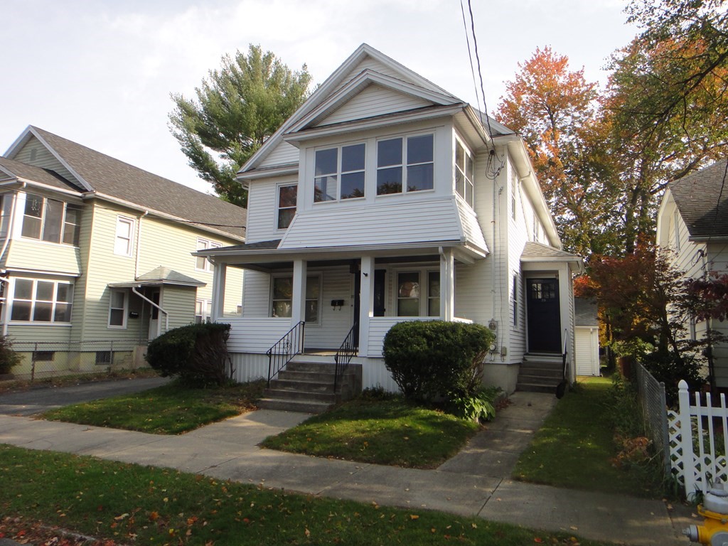 27-29 Howes Street Springfield, MA 01118 - Photo 2 of 28 a front view of a house with garden