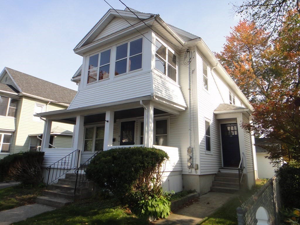 27-29 Howes Street Springfield, MA 01118 - Photo 3 of 28 a front view of a house with a garden
