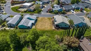 an aerial view of residential house with outdoor space and swimming pool