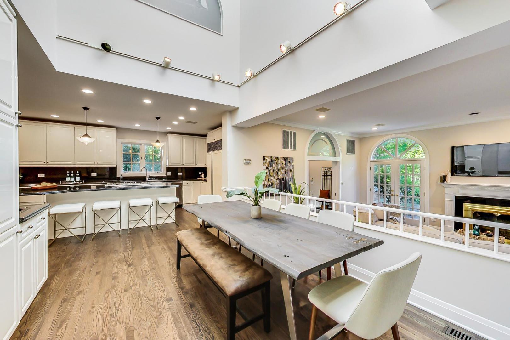 1037 Hillside Road Northbrook, IL 60062 - Photo 12 of 46 a view of a dining room with furniture window and wooden floor