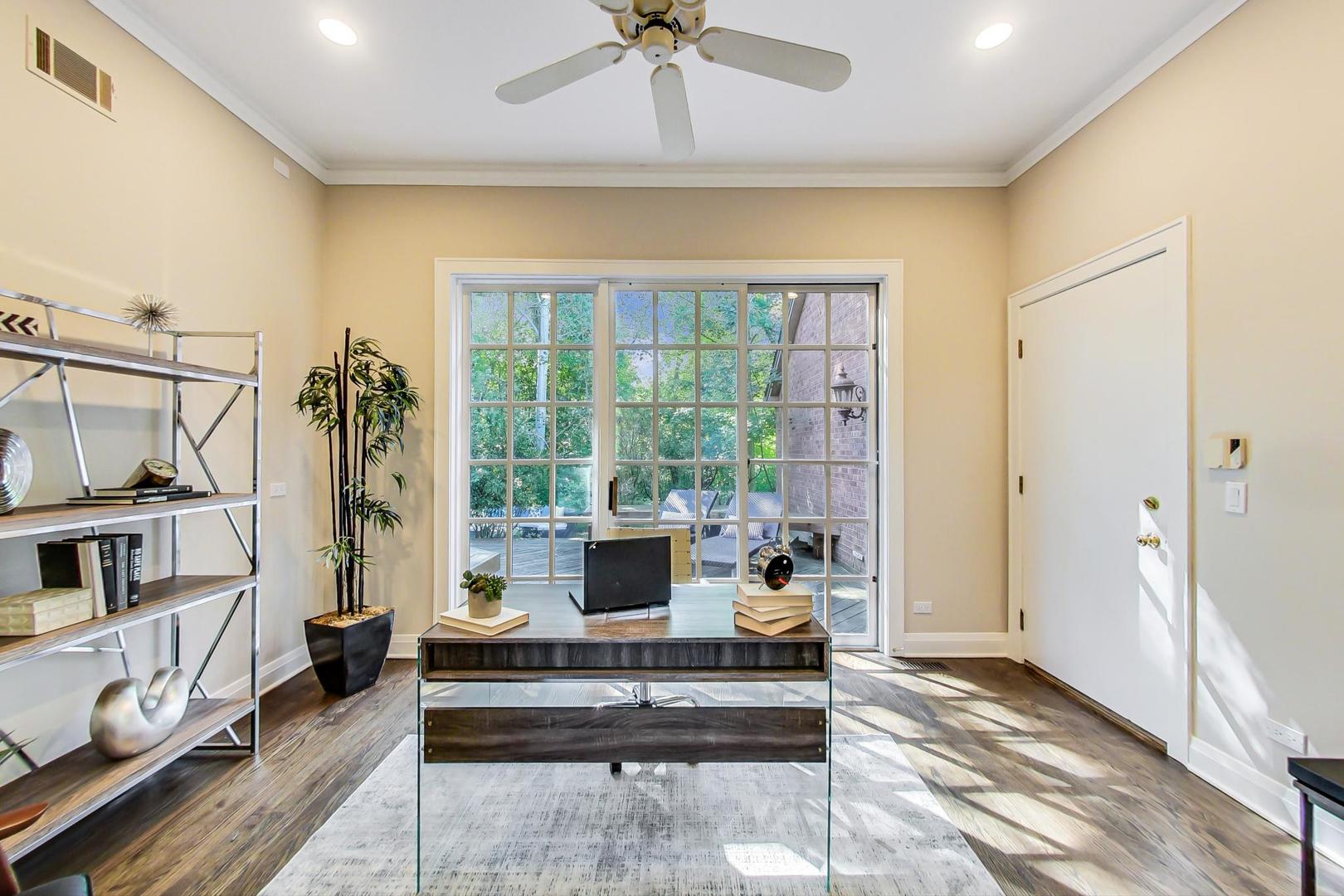 1037 Hillside Road Northbrook, IL 60062 - Photo 16 of 46 a living room with furniture and a floor to ceiling window