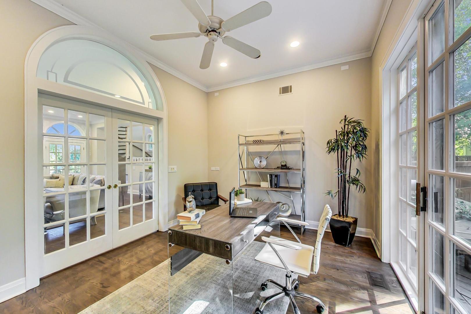 1037 Hillside Road Northbrook, IL 60062 - Photo 17 of 46 a living room with furniture a chandelier and a floor to ceiling window