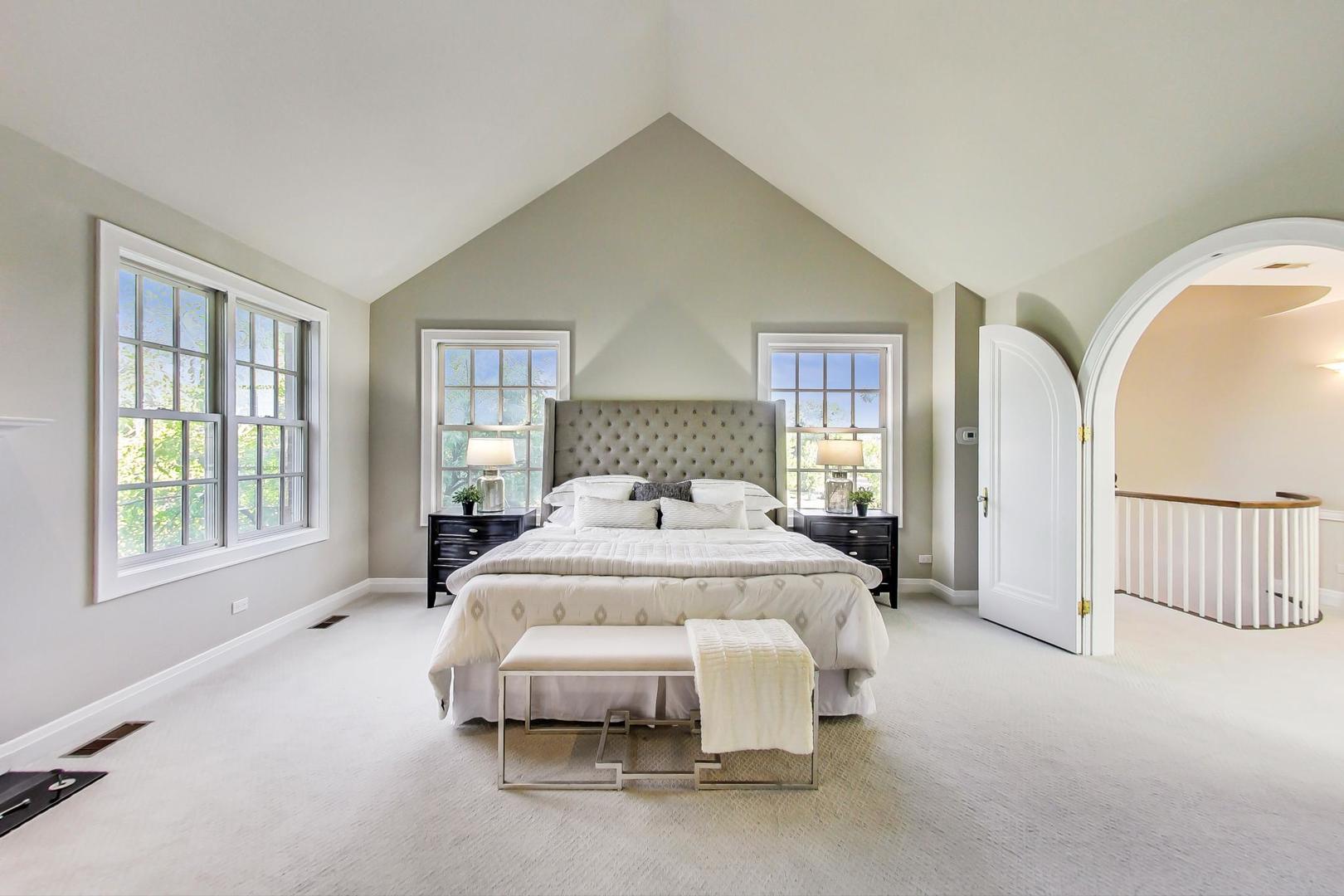 1037 Hillside Road Northbrook, IL 60062 - Photo 20 of 46 a spacious bedroom with a bed and a window