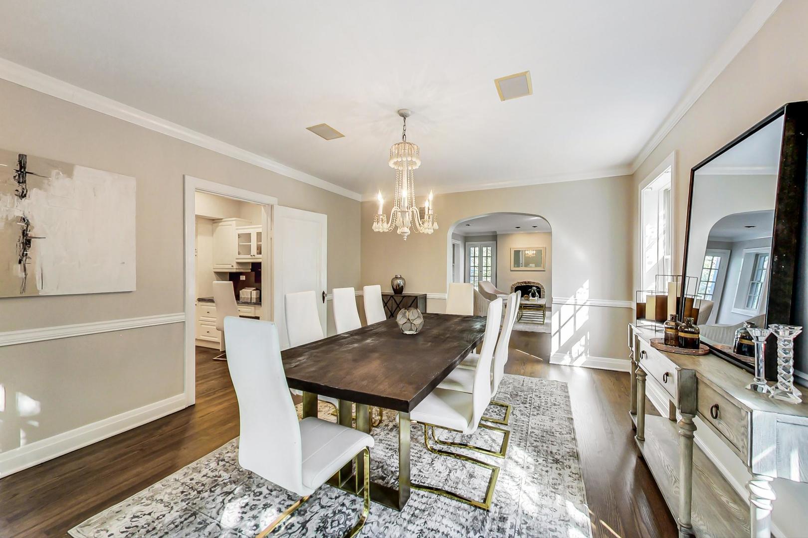 1037 Hillside Road Northbrook, IL 60062 - Photo 5 of 46 a view of a dining room with furniture window and wooden floor