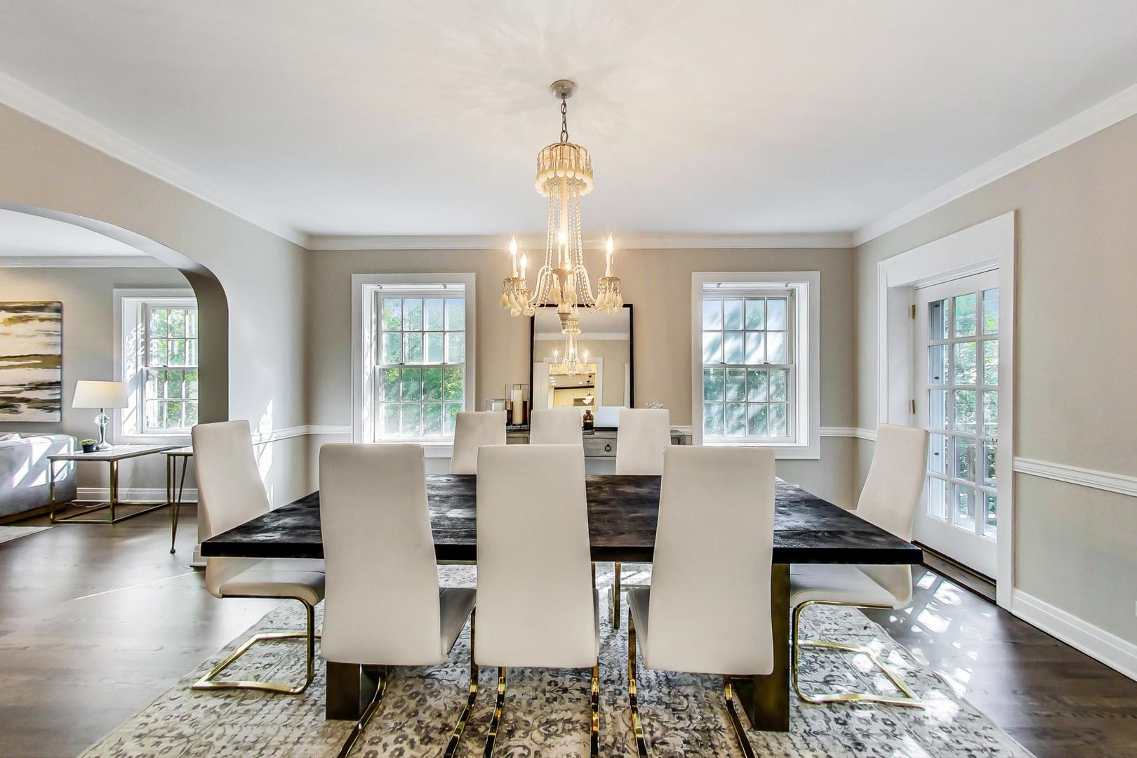1037 Hillside Road Northbrook, IL 60062 - Photo 6 of 46 a view of a dining room with furniture wooden floor and chandelier