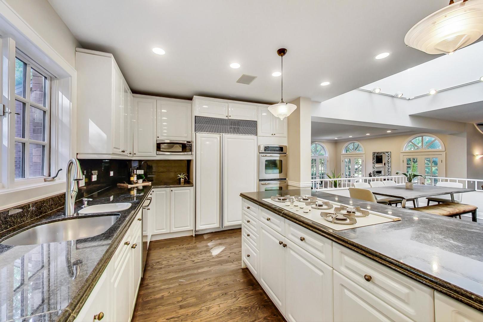 1037 Hillside Road Northbrook, IL 60062 - Photo 8 of 46 a open kitchen with stainless steel appliances granite countertop a sink stove and refrigerator
