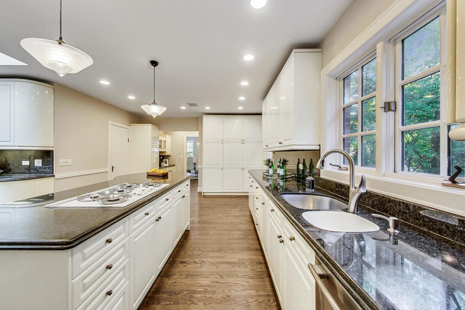 1037 Hillside Road Northbrook, IL 60062 - Photo 9 of 46 a large kitchen with granite countertop lots of counter top space