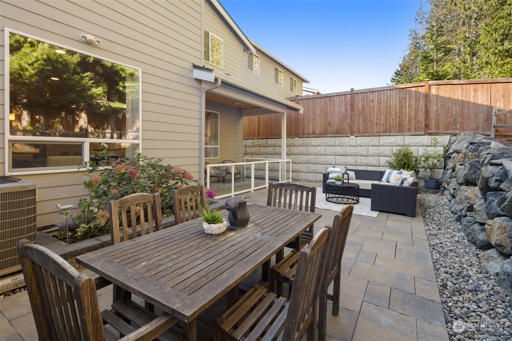 1243 Northwest Richmond Beach Road Shoreline, WA 98177 - Photo 17 of 40 a view of a patio with table and chairs with wooden floor and fence