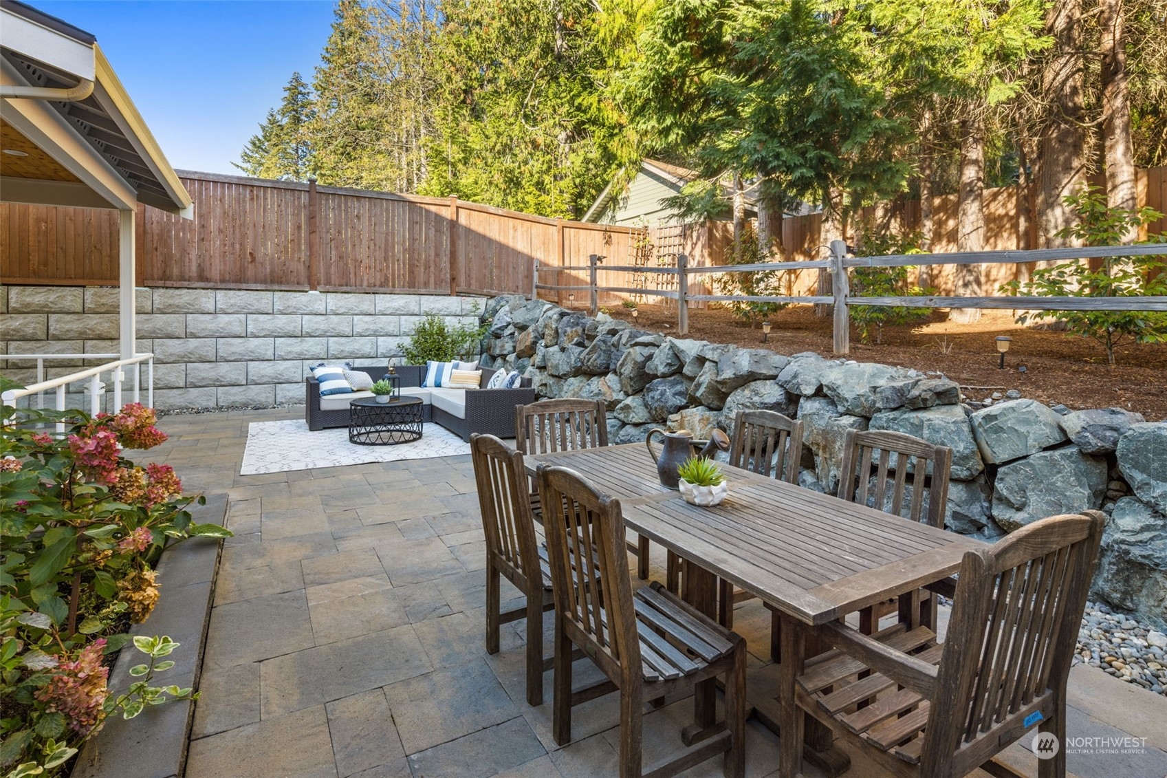 1243 Northwest Richmond Beach Road Shoreline, WA 98177 - Photo 18 of 40 a view of a backyard with table and chairs