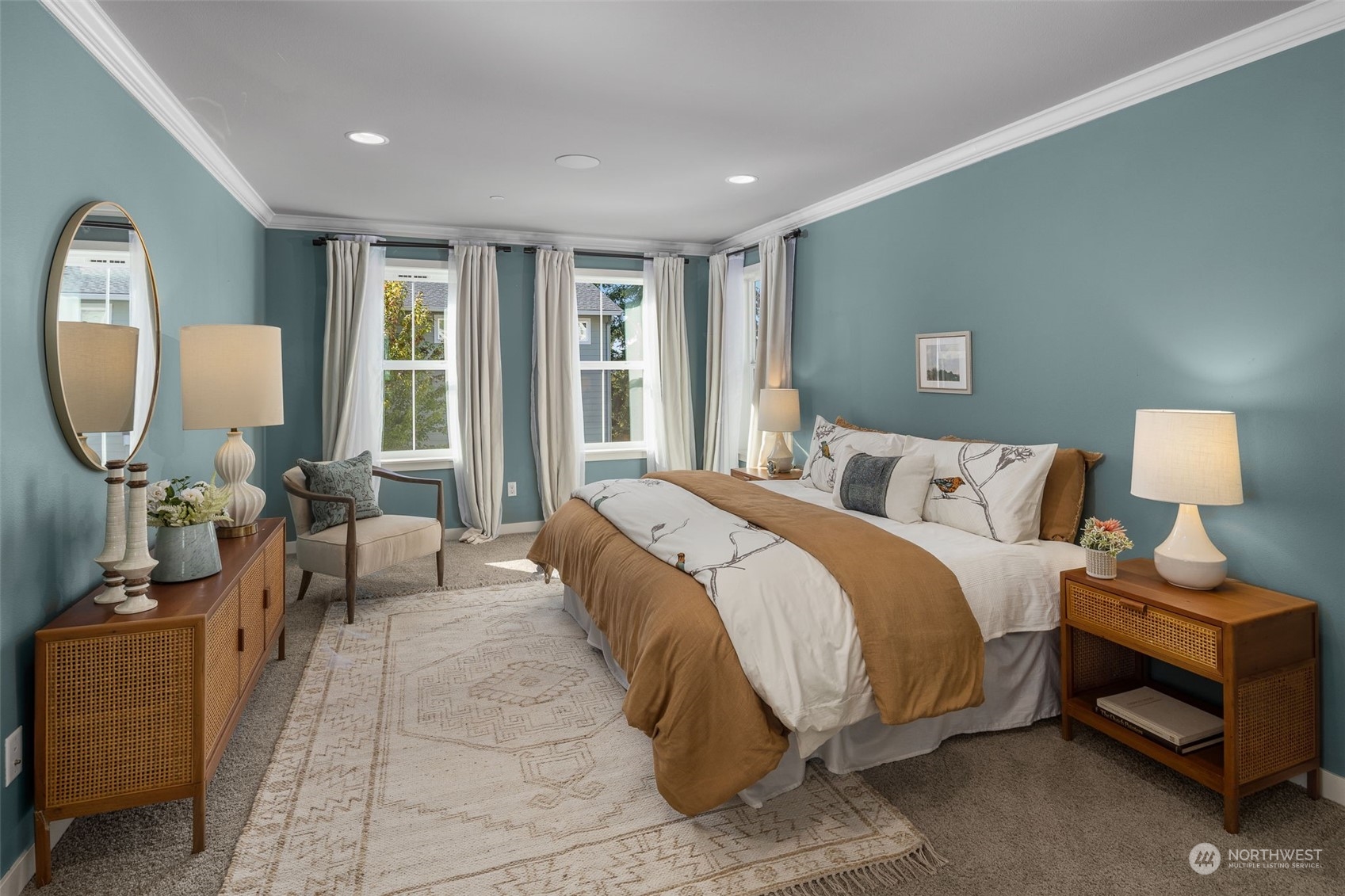 1243 Northwest Richmond Beach Road Shoreline, WA 98177 - Photo 21 of 40 a spacious bedroom with a bed a mirror on desk and a window