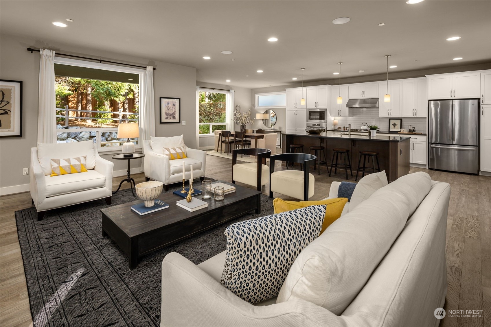 1243 Northwest Richmond Beach Road Shoreline, WA 98177 - Photo 5 of 40 a living room with furniture kitchen and a table