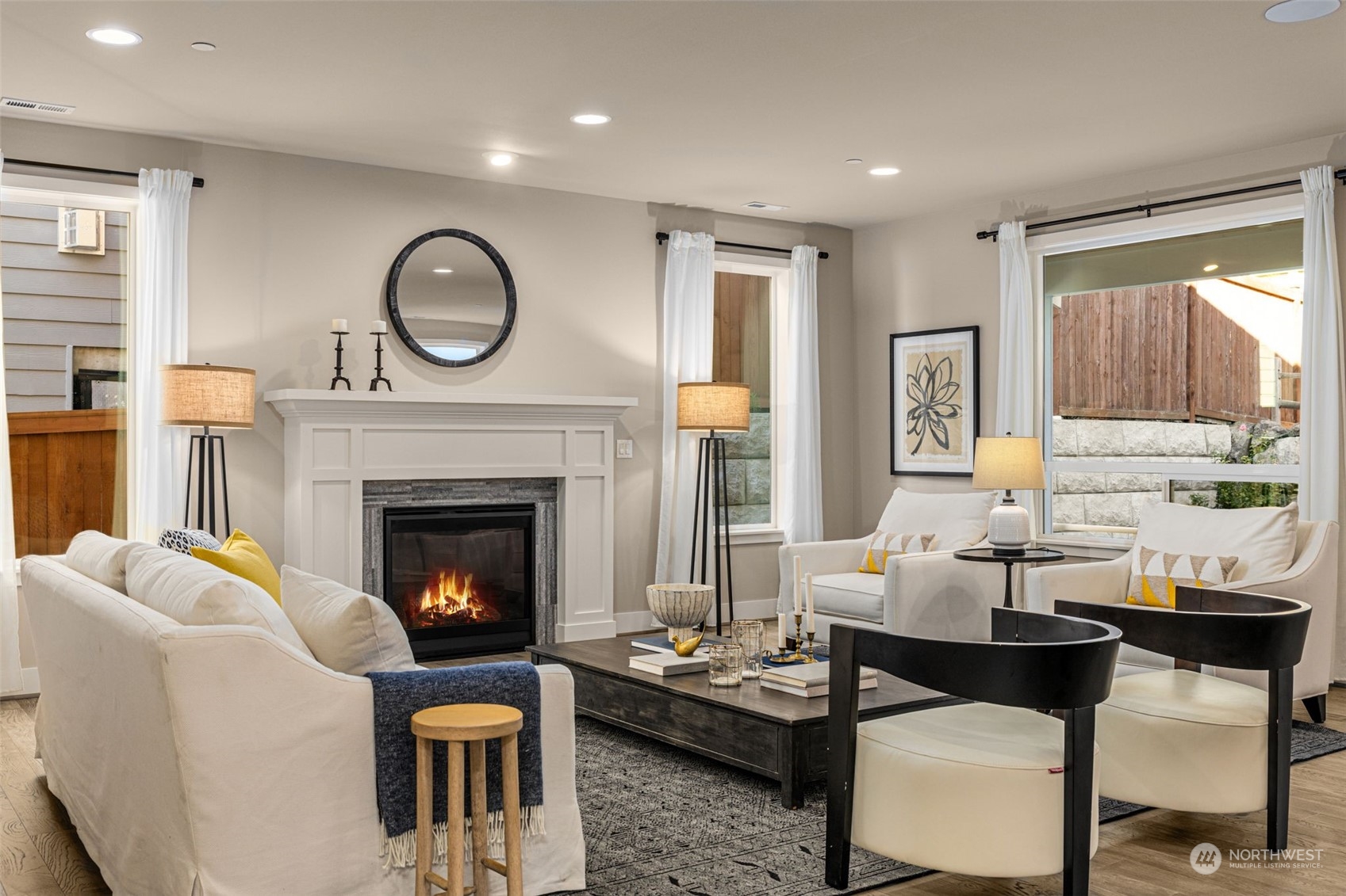 1243 Northwest Richmond Beach Road Shoreline, WA 98177 - Photo 6 of 40 a living room with furniture a fireplace and a large window