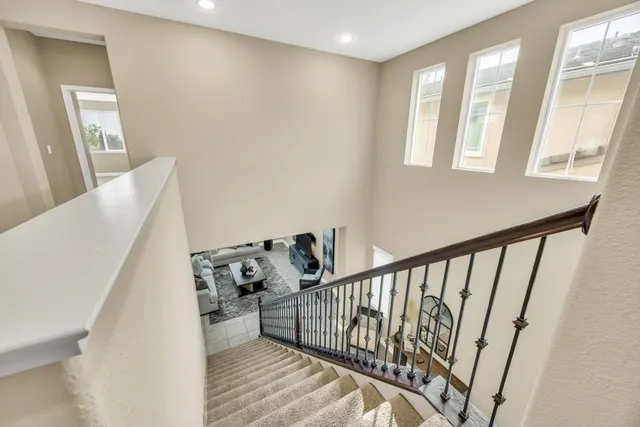 a view of entryway with stairs and wooden floor