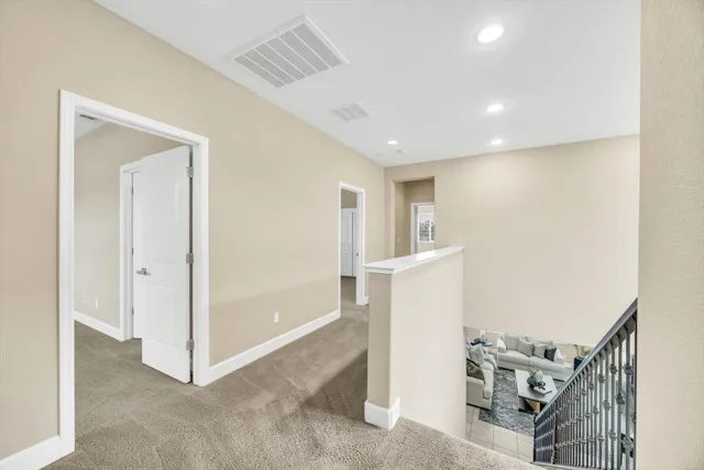 a view of a hallway with workspace and entryway