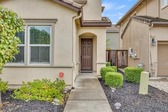 a front view of a house with garden