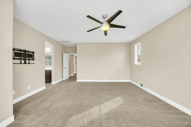 a view of a livingroom with a ceiling fan