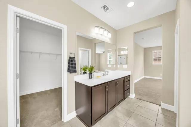 a bathroom with a sink and mirror