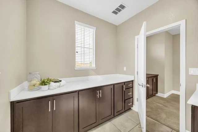 a bathroom with a sink vanity and a mirror