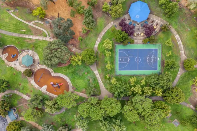 an aerial view of a house with garden space sitting space and swimming pool