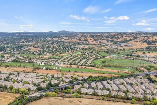 an aerial view of residential building and lake