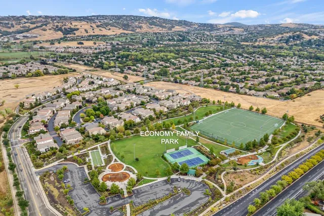 an aerial view of residential houses with outdoor space
