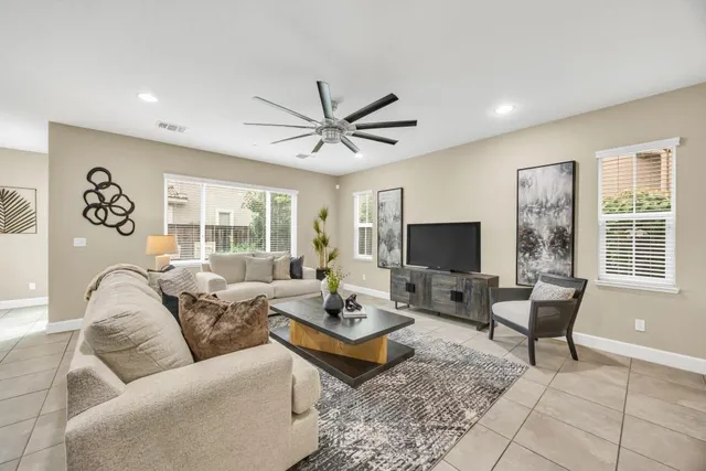 a living room with furniture and a large window