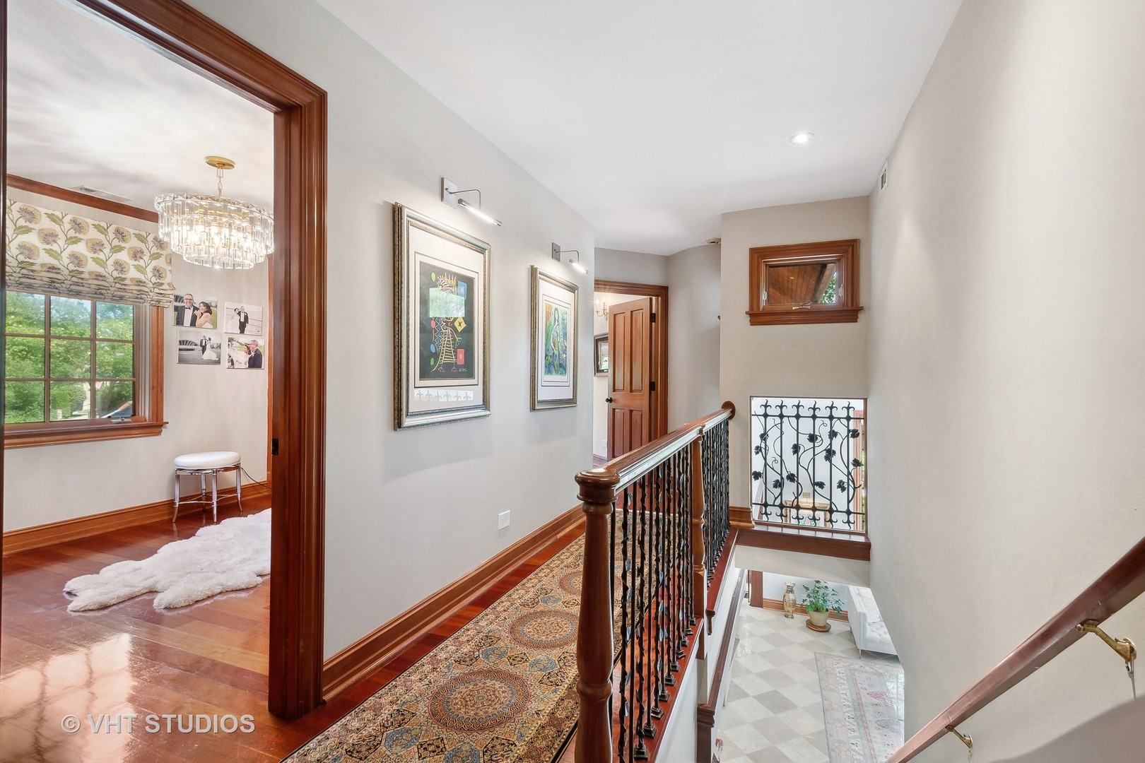305 Central Avenue Wilmette, IL 60091 - Photo 14 of 42 a view of a hallway with wooden floor and stairs