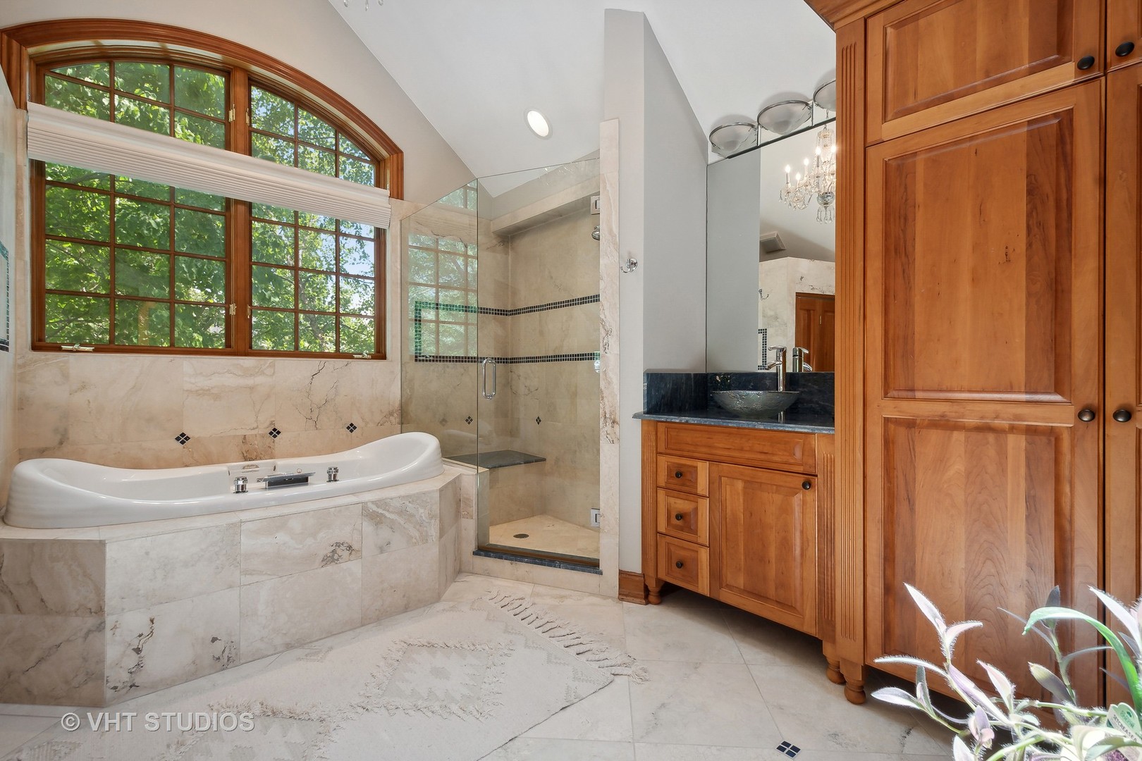 305 Central Avenue Wilmette, IL 60091 - Photo 16 of 42 a bathroom with a tub sink and mirror