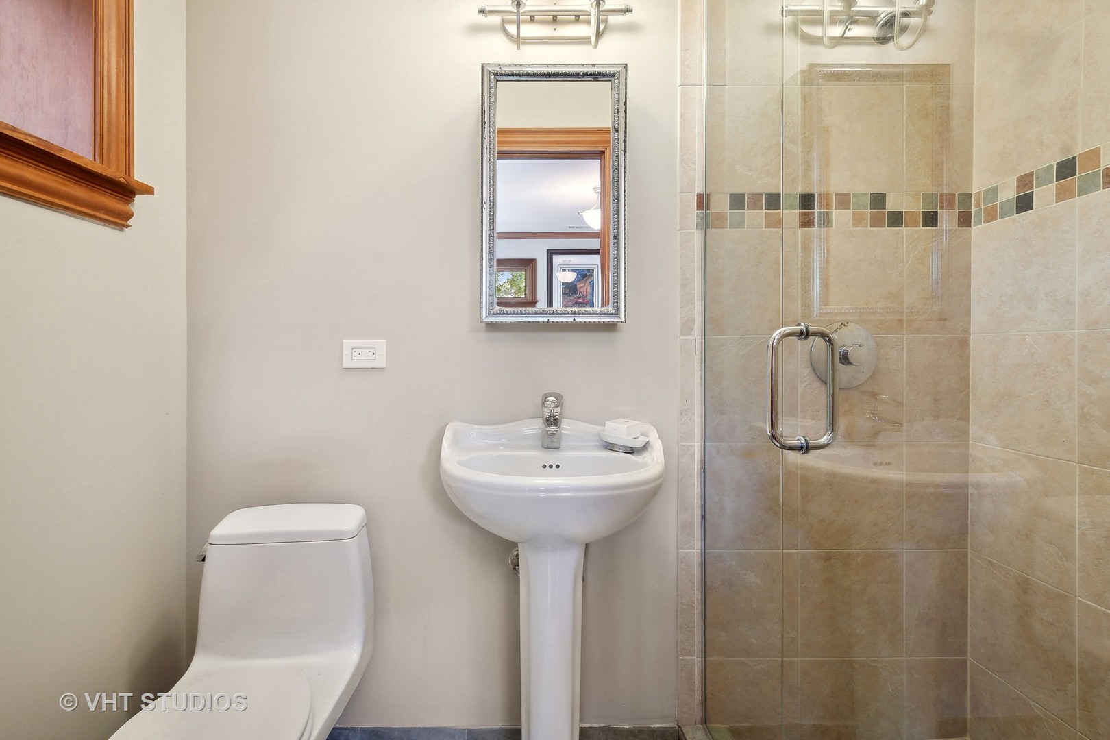 305 Central Avenue Wilmette, IL 60091 - Photo 19 of 42 a bathroom with a sink a toilet and mirror
