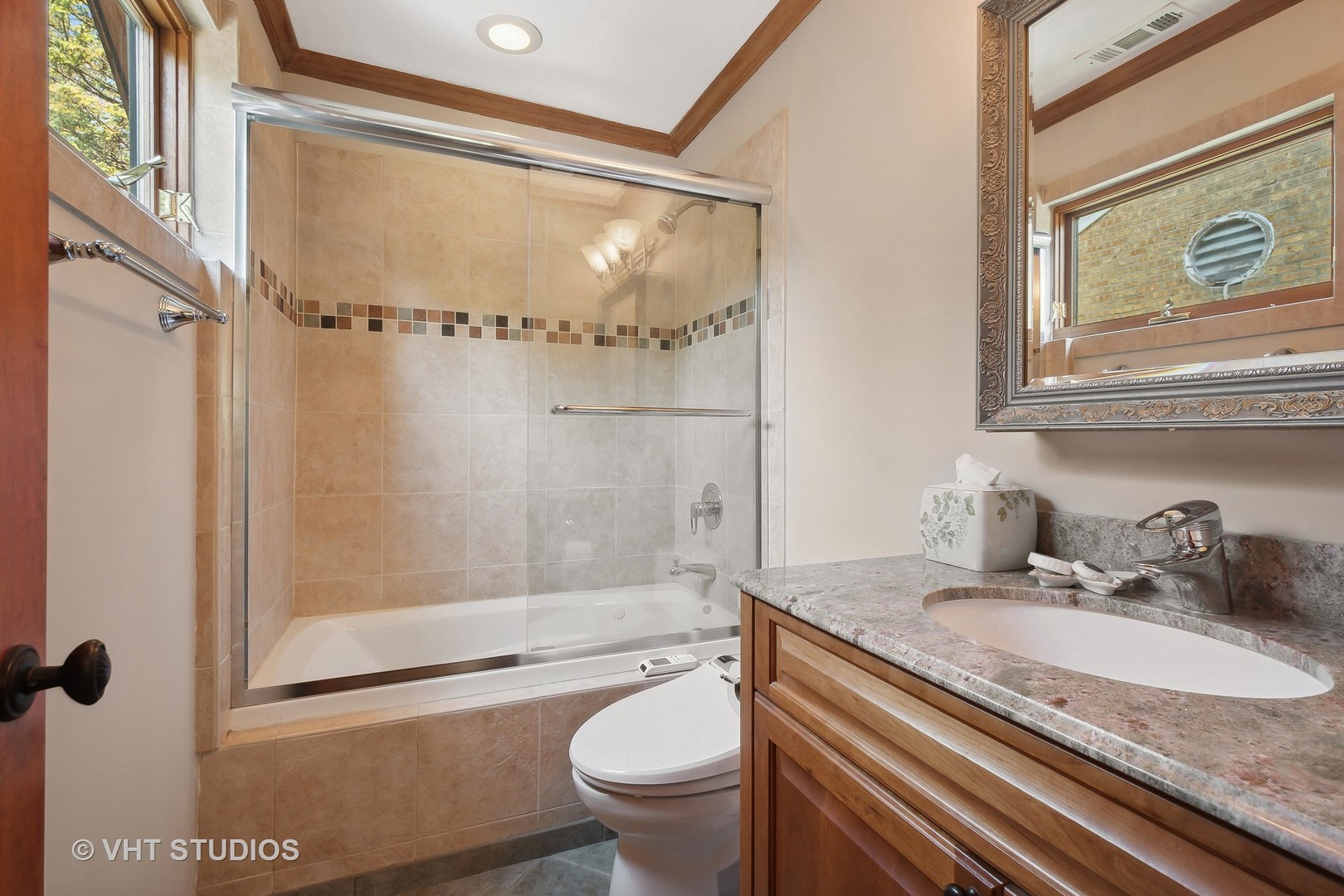 305 Central Avenue Wilmette, IL 60091 - Photo 21 of 42 a bathroom with a granite countertop sink toilet and shower