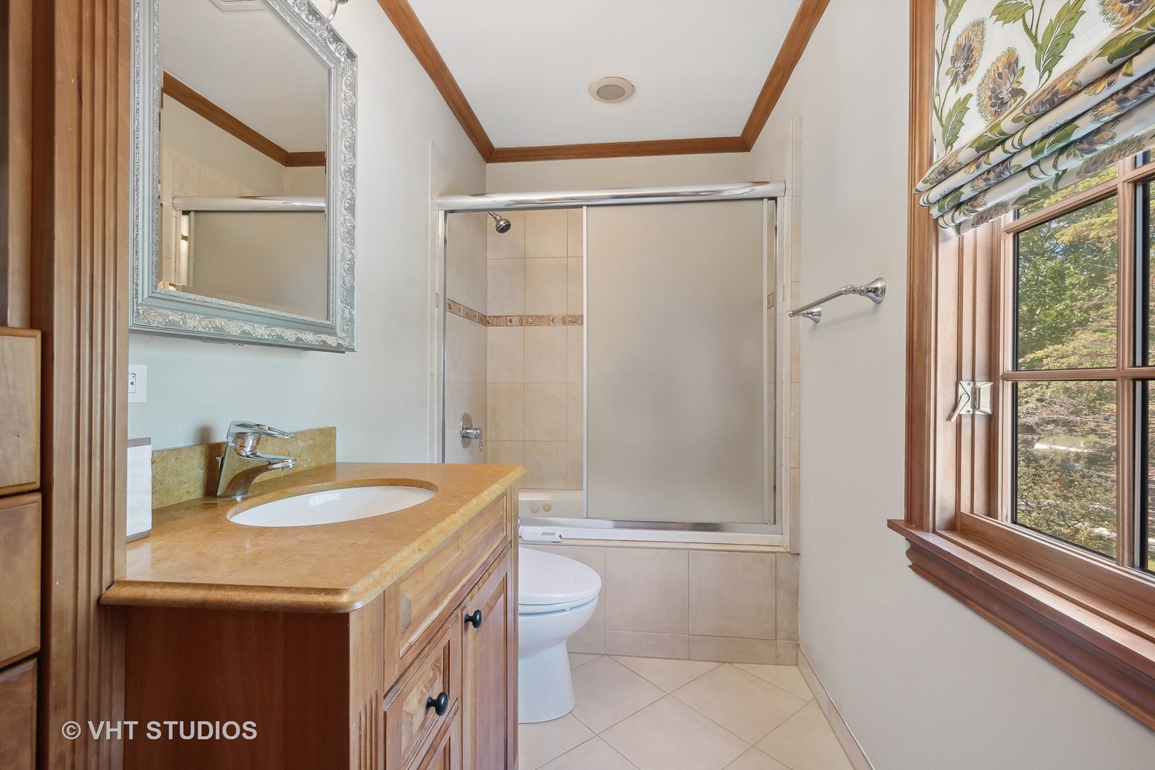 305 Central Avenue Wilmette, IL 60091 - Photo 23 of 42 a bathroom with a sink a toilet and shower