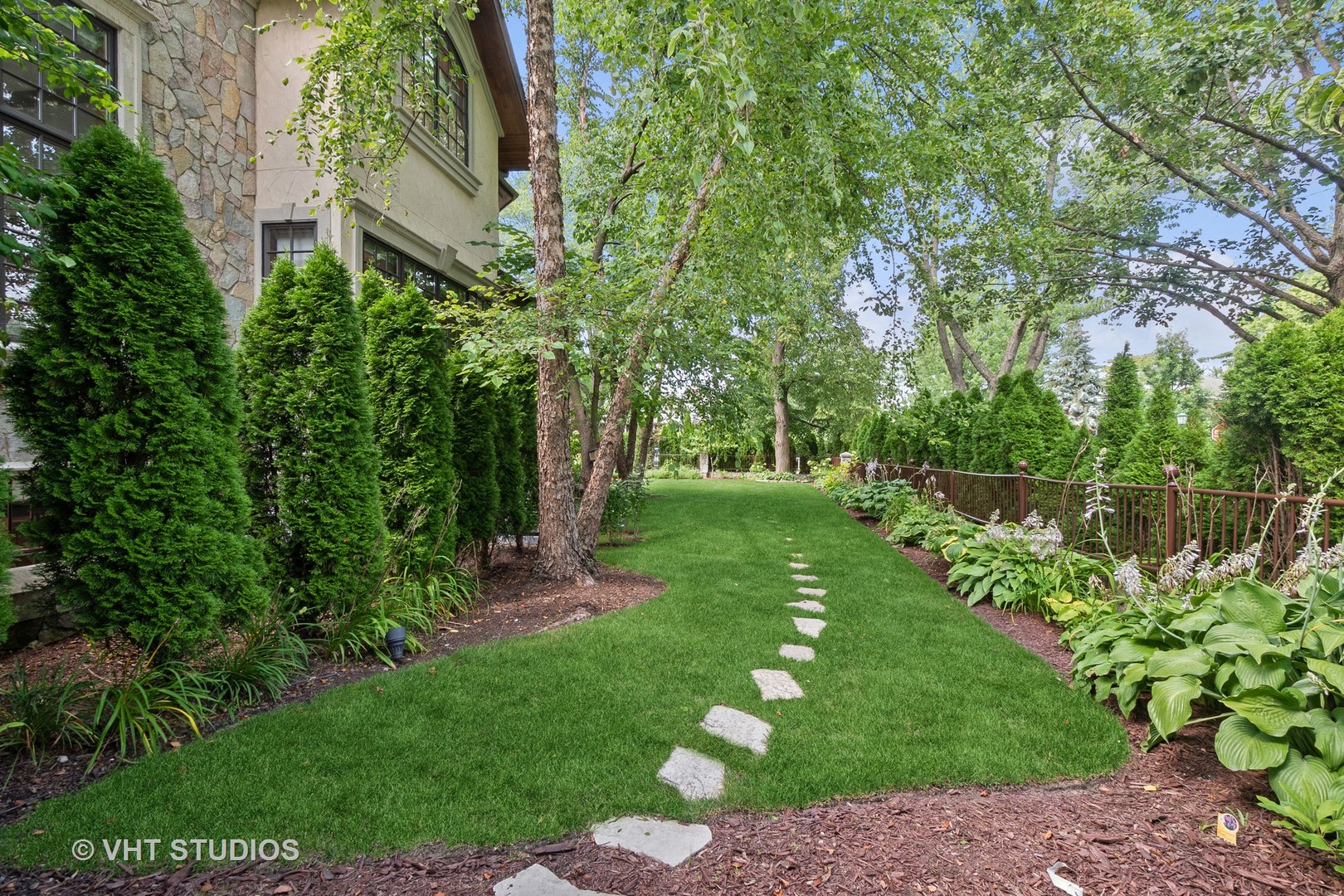 305 Central Avenue Wilmette, IL 60091 - Photo 31 of 42 a view of a garden with large trees