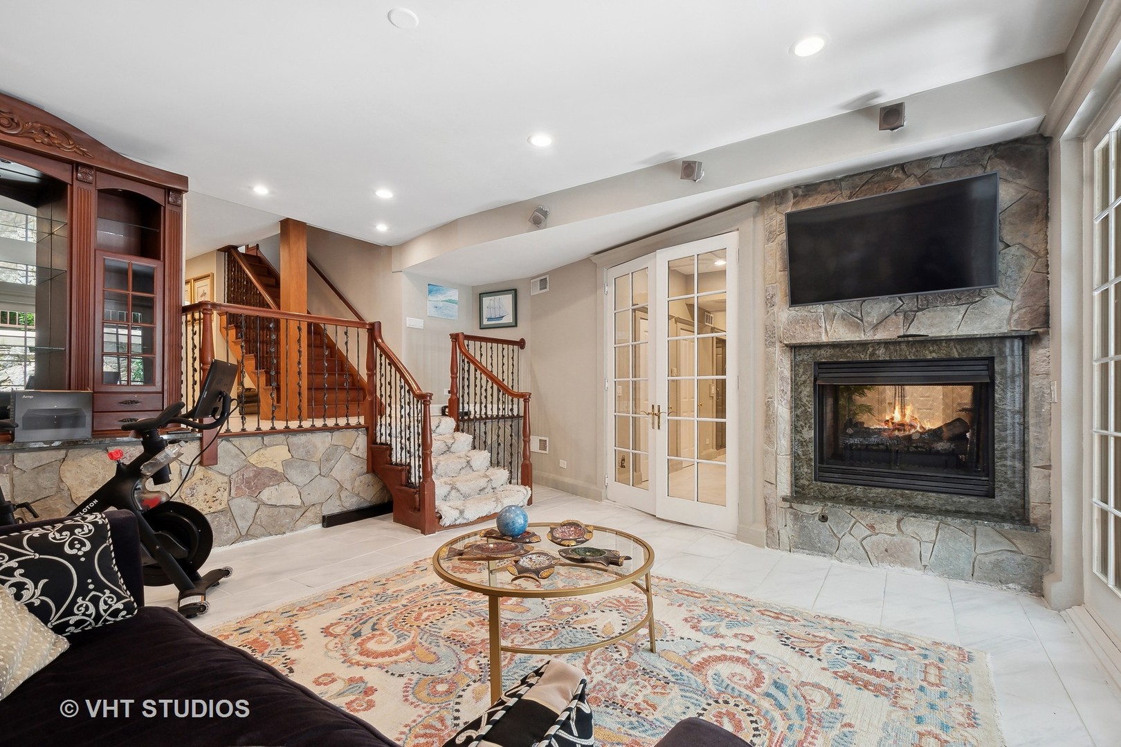 305 Central Avenue Wilmette, IL 60091 - Photo 32 of 42 a living room with furniture a flat screen tv and a fireplace