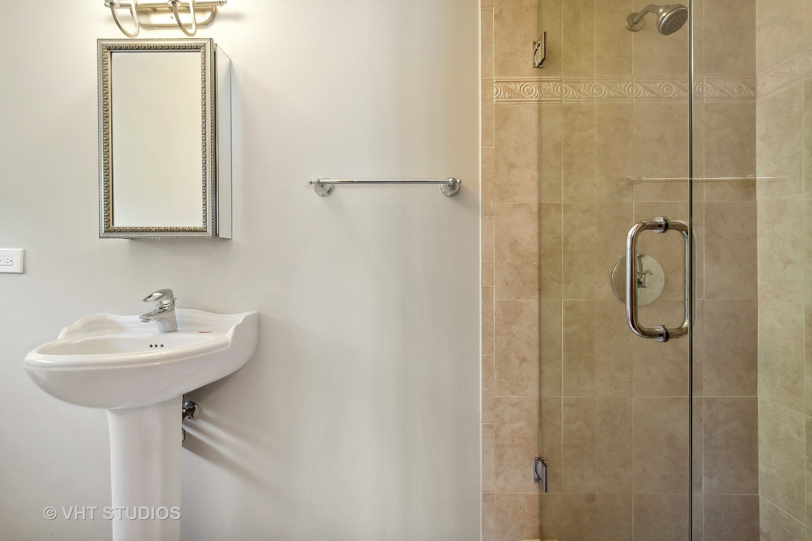 305 Central Avenue Wilmette, IL 60091 - Photo 34 of 42 a bathroom with a sink a mirror and shower