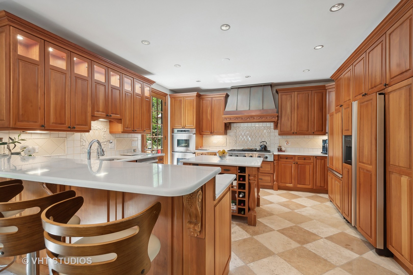 305 Central Avenue Wilmette, IL 60091 - Photo 7 of 42 a kitchen with granite countertop a sink stove and refrigerator