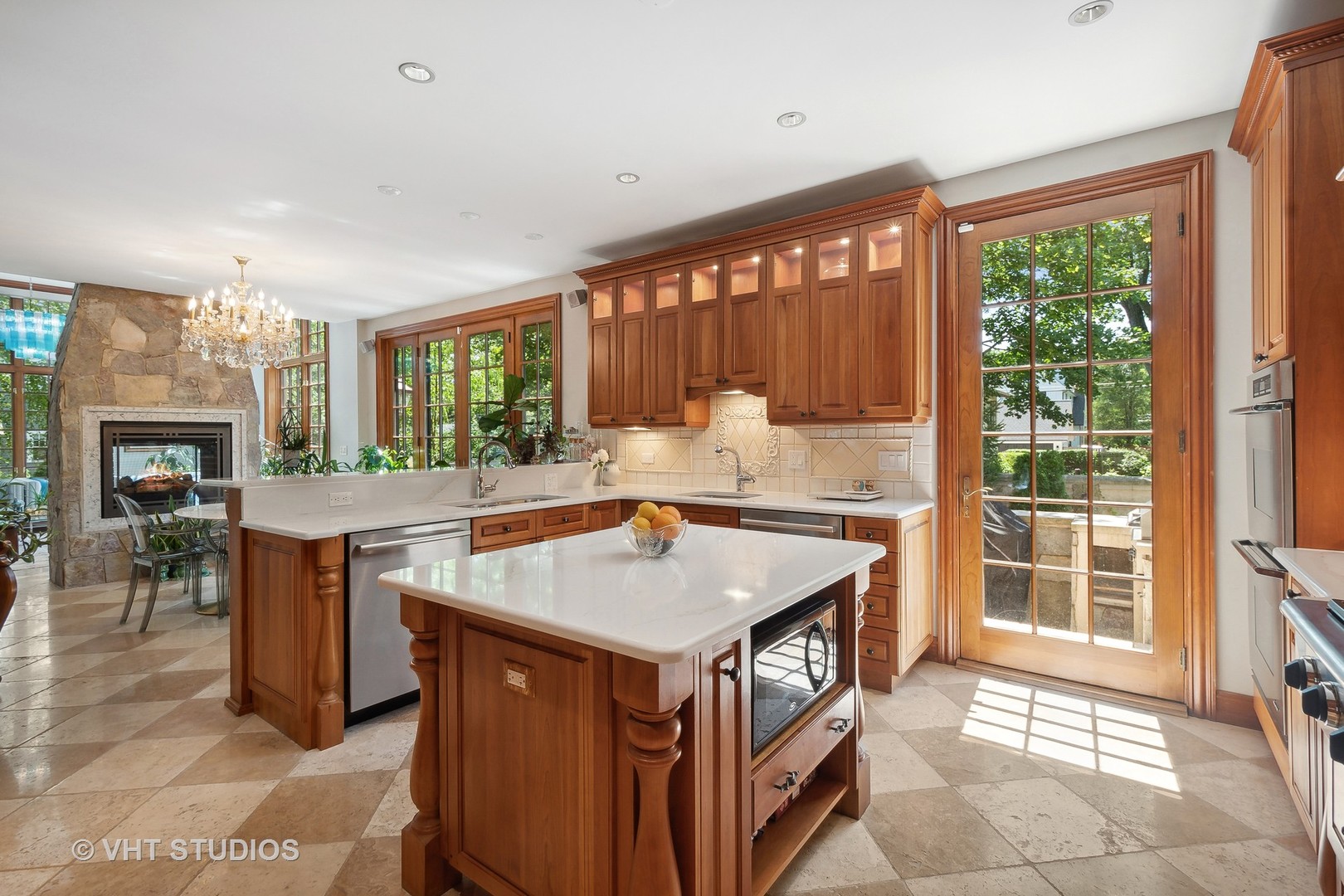 305 Central Avenue Wilmette, IL 60091 - Photo 8 of 42 a kitchen with a stove a sink a counter top space and living room view
